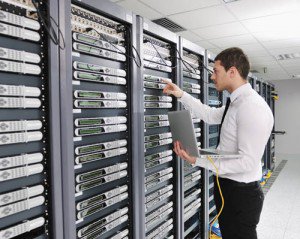 young engineer in datacenter server room