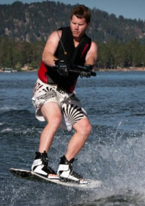 Tom trying out the sport of wakeboarding