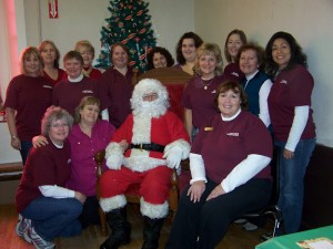 Muffins with Santa Team Pam and her team with Santa