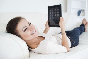 woman using a tablet to search for an apartment