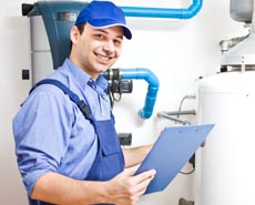 Technician servicing an hot-water heater