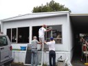 volunteers installing windows