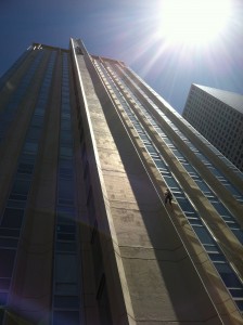 A participant in the Over the Edge fundraiser looks tiny from the ground.
