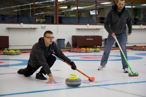 Cory on the ice during a curling tournament.