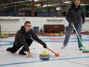 Cory on the ice during a curling tournament.