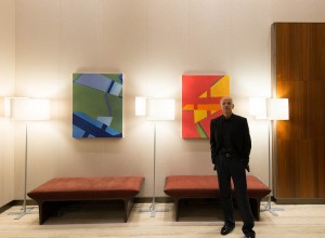 Derek Reist with his artwork at 1214 Fifth Avenue.