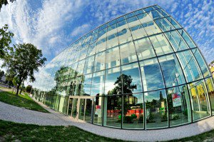 Glass building with clouds