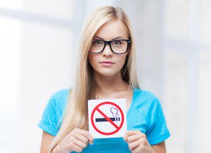 woman with smoking restriction sign