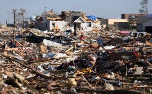 People survey the damage in the Washington Estates sudivision in the aftermath of a tornado on November 18, 2013 in Washington, Illinois. A fast-moving storm system that produced several tornadoes that touched down across the Midwest left behind a path of destruction in 12 states. (Photo by Tasos Katopodis/Getty Images)