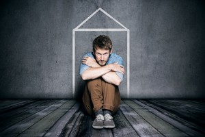 man in tiny apartment