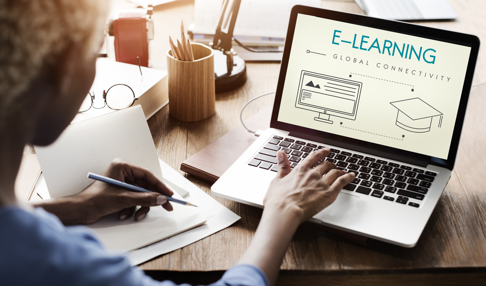 african american woman at laptop completing e-learning course
