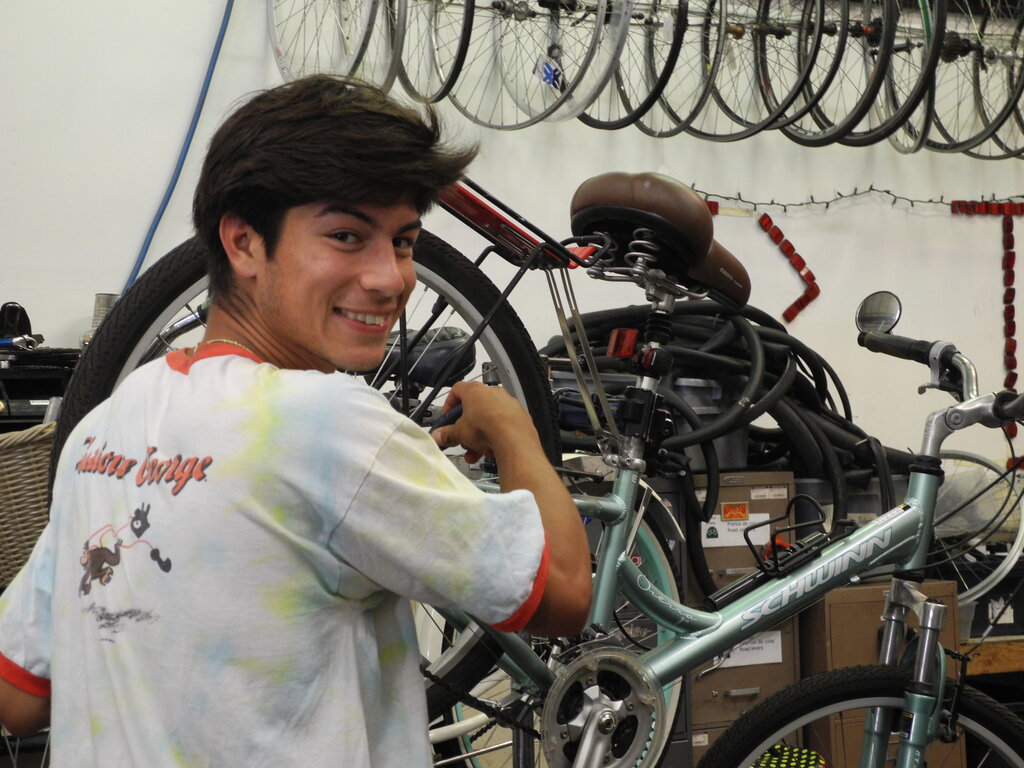 MOVE volunteer fixing bicycles