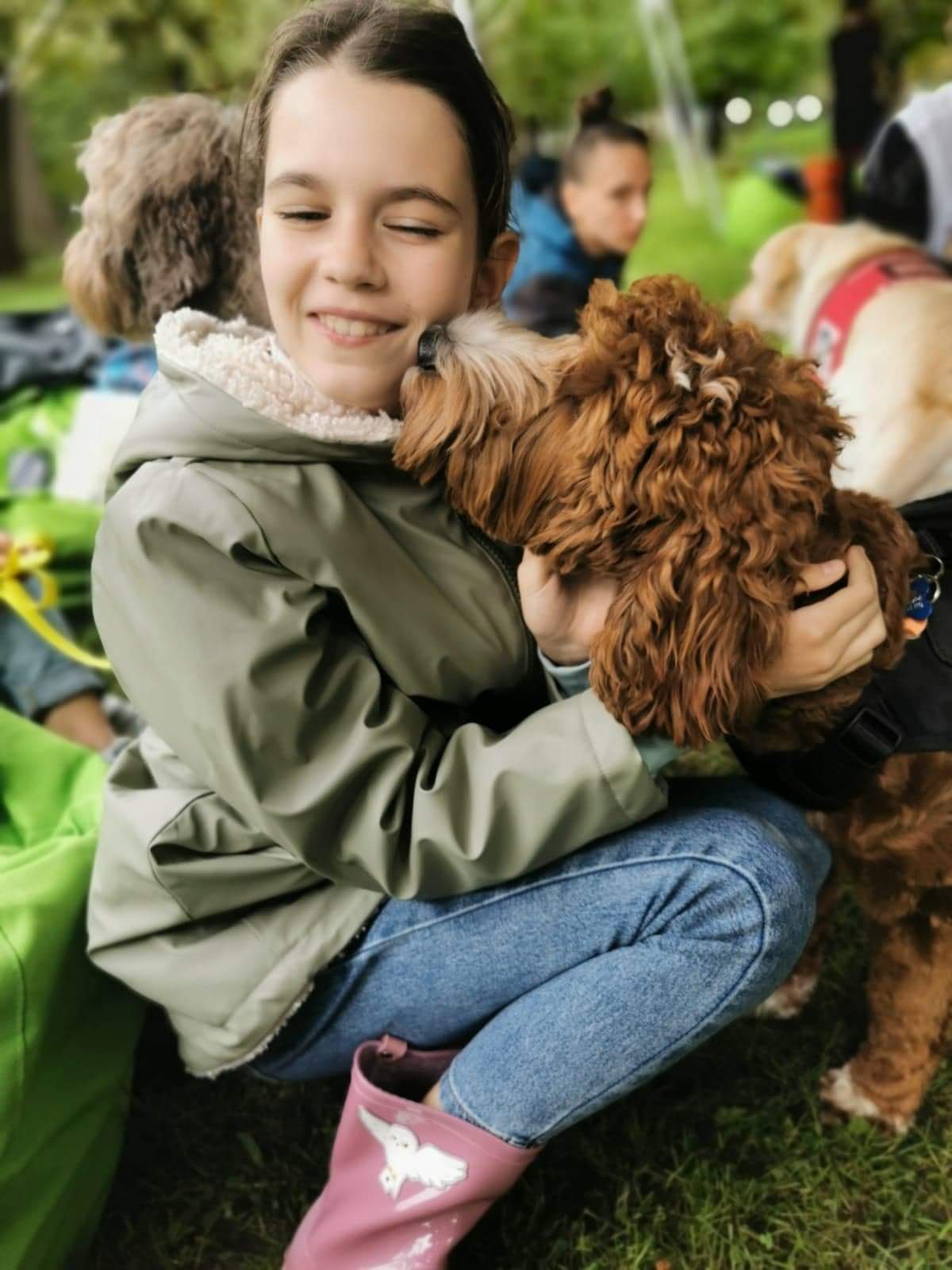 Kid and dog at Dog Assist Association