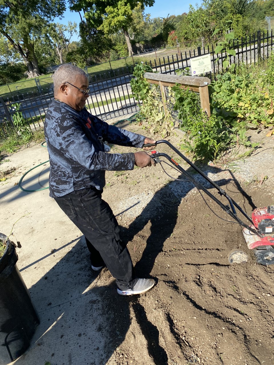 Front Steps client working on the gardens