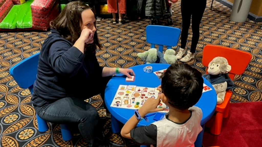 Children learning American Sign Language at SDHHS event