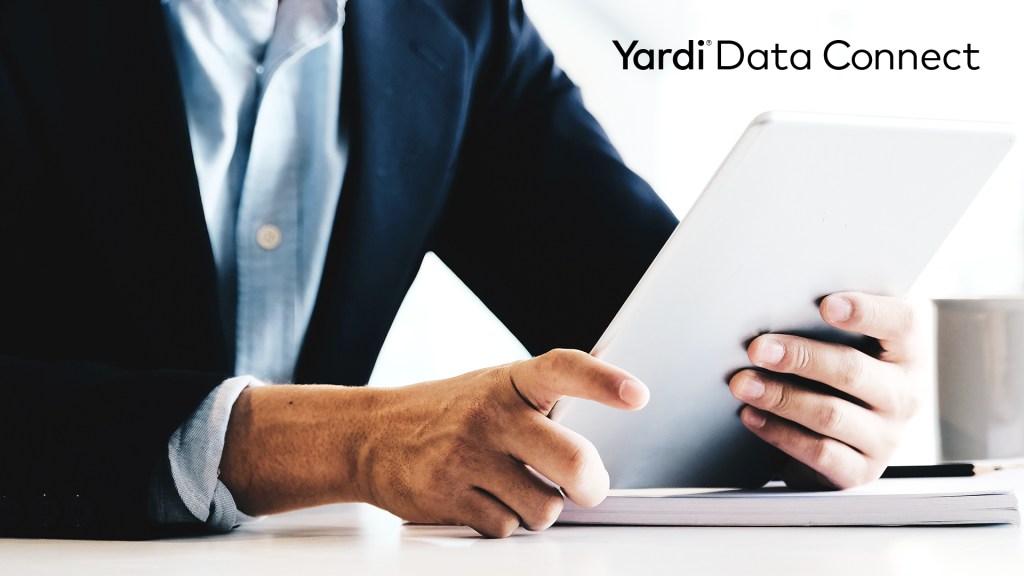 Text: "Yardi Data Connect," with image of person holding piece of paper
