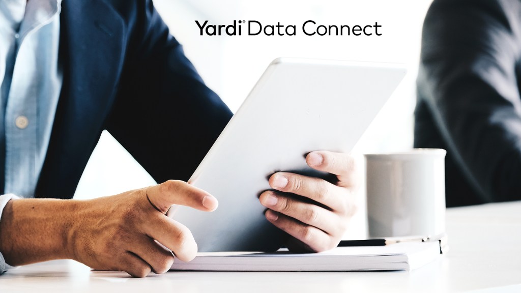 Text: "Yardi Data Connect," with image of person holding piece of paper