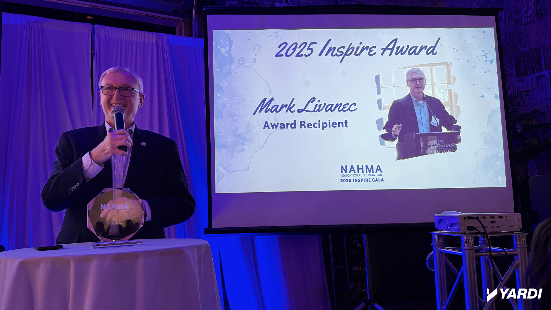 Mark Livanec receiving the 2025 NAHMA Inspiration Award