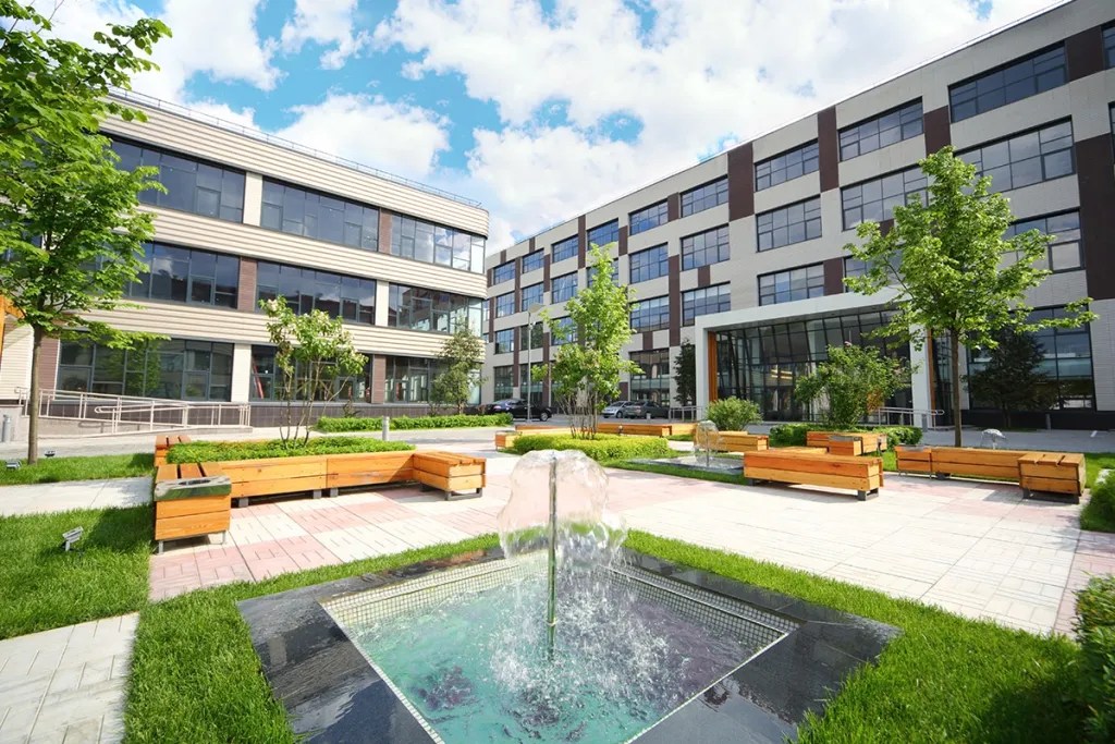 Exterior of commercial building with fountain in courtyard