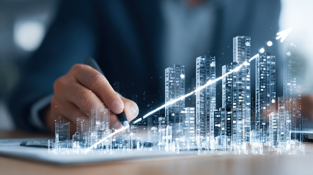 Image of city, with a hand drawing long the skyline