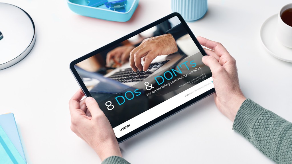 Hands holding an ebook titled "8 dos & don'ts for senior living community websites"
