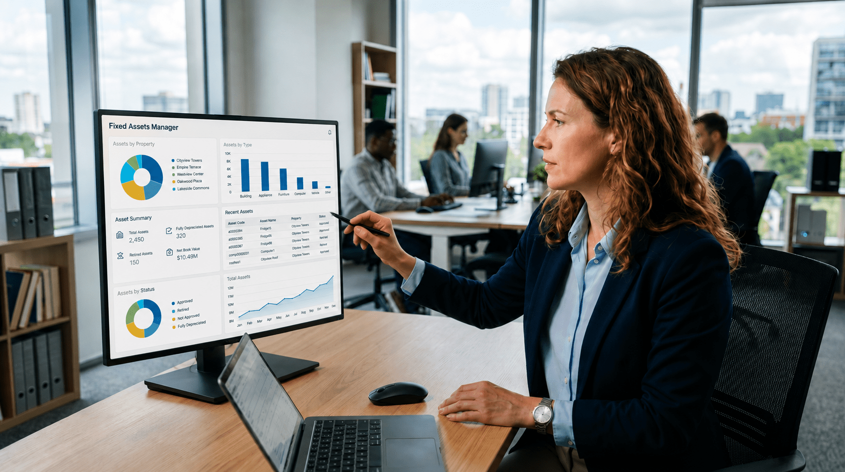 Woman looking at Fixed Assets Manager on a computer
