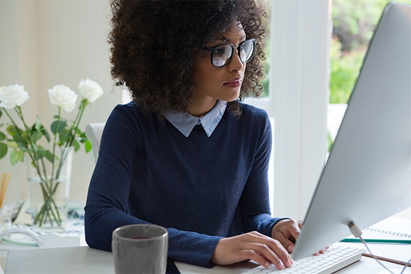 Leasing agent looking at computer