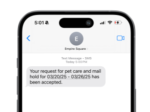 A message on an iPhone from Empire Square reading "Your request for pet care and mail hold for 03/20/25 - 03/26/25 has been accepted.