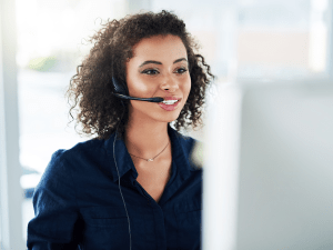 An apartment call center agent taking a call on a headset