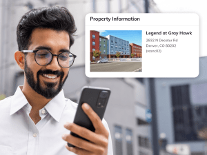A resident looking at property information on a smart phone