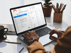 An image of an apartment employee using RentCafe CRM IQ on a laptop.