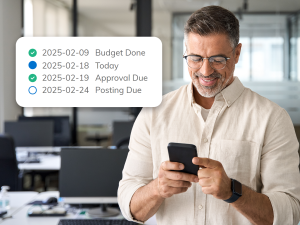 A man looking at his smart phone seeing the status of a budget