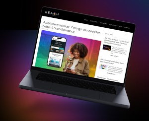 Image of the OutREACH News blog being displayed on a tilted laptop