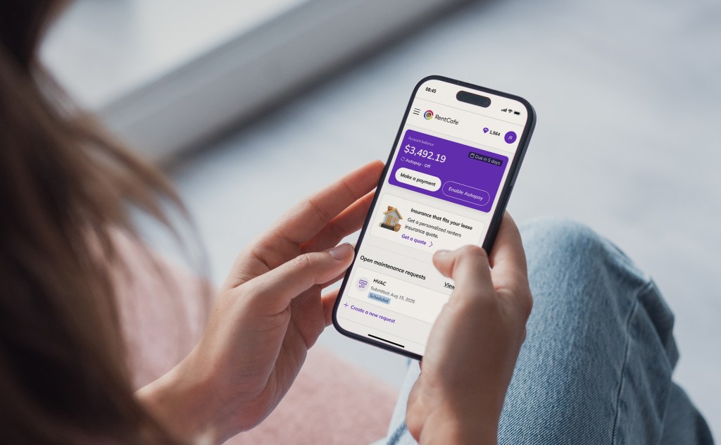 Resident viewing account balance, autopay options and an open maintenance request in the RentCafe resident portal on a smartphone
