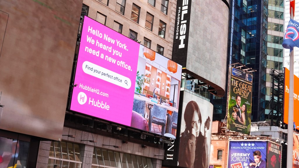 Billboard ad for Hubble in Times Square, New York City. Ad reads: “Hello New York. We heard you need a new office. Find your perfect office, HubbleHQ.com”