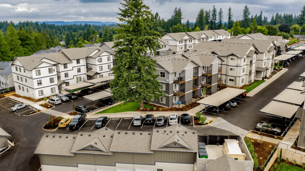 Aerial view of a Stratum multifamily apartment community in Oregon, surrounded by evergreen trees